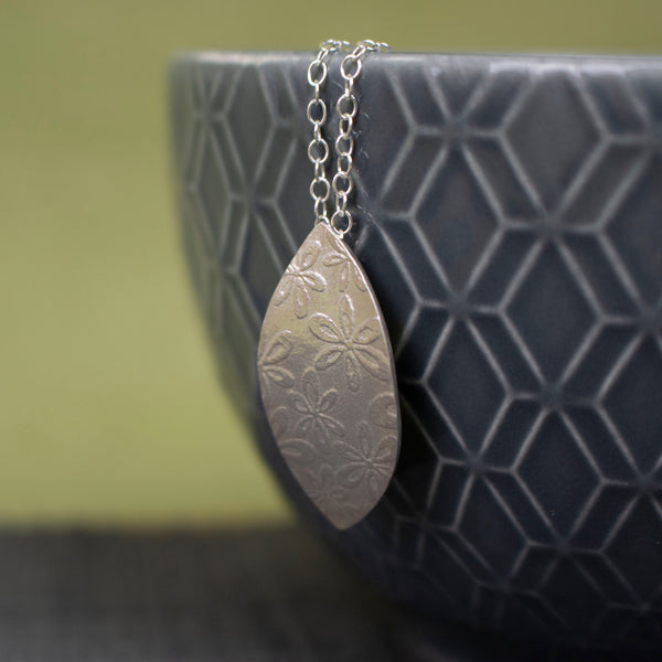 sterling silver petal shaped pendant by Joanne Tinley Jewellery