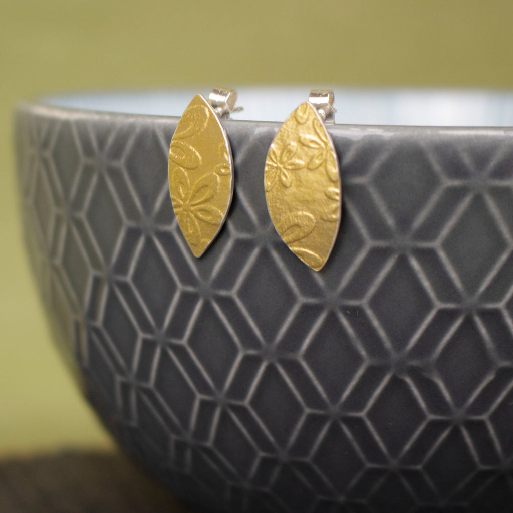 24k gold and silver flower patterned petal shaped stud earrings by Joanne Tinley Jewellery