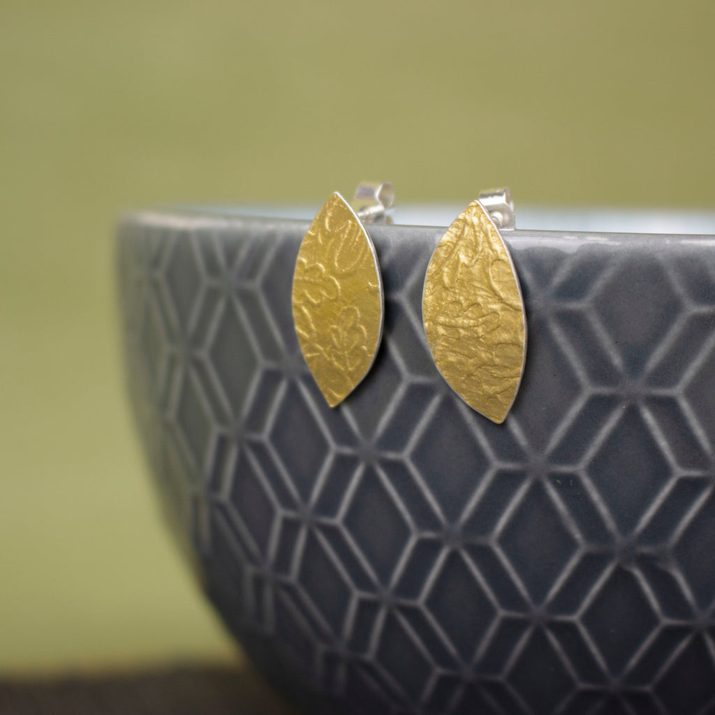 24k gold and silver oak leaf patterned petal shaped stud earrings by Joanne Tinley Jewellery