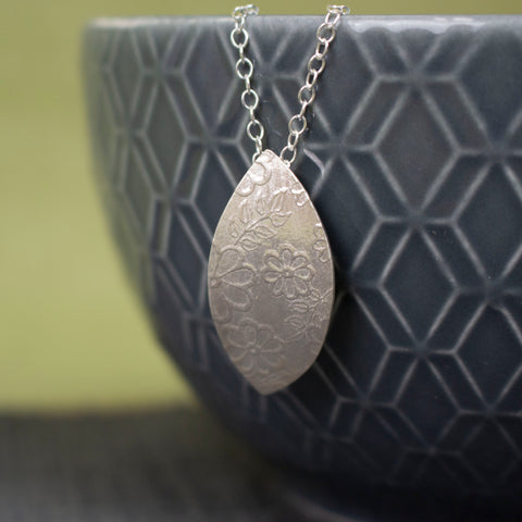 sterling silver petal shaped pendant by Joanne Tinley Jewellery