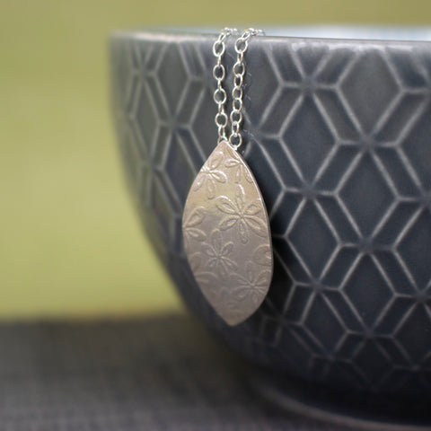 sterling silver petal shaped pendant by Joanne Tinley Jewellery