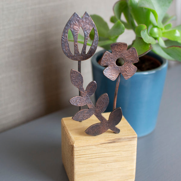 tulip,daisy and leaf ornament handcrafted from copper and oak by Joanne Tinley