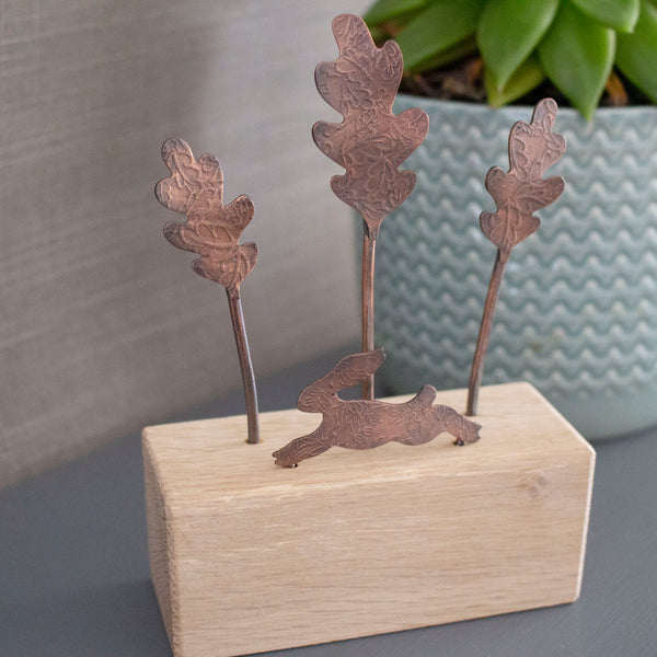 copper and oak handcrafted ornament featuring a running hare and oak leaf trees - Joanne Tinley Jewellery