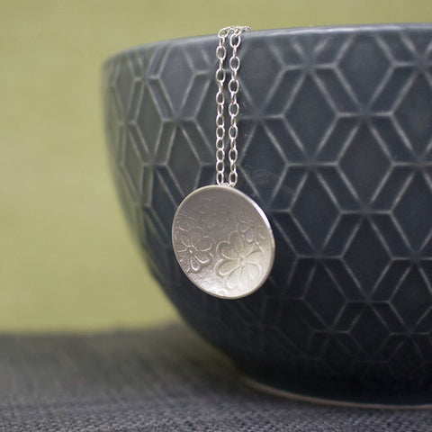 sterling silver flower disc pendant at Joanne Tinley Jewellery