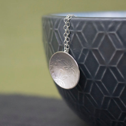 sterling silver flower disc pendant at Joanne Tinley Jewellery